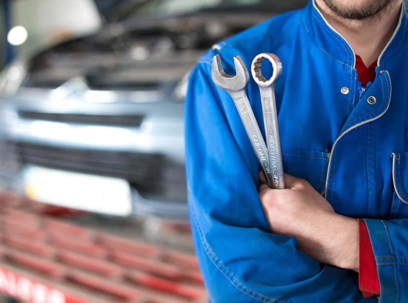 mechanic holding a wrench